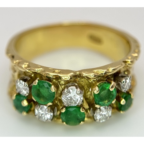 37 - An 18K Yellow Gold Emerald and Diamond Band Ring. c. 0.50ctw of round cut emeralds and c. 0.50ctw of... 