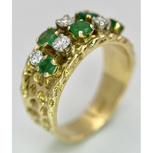 37 - An 18K Yellow Gold Emerald and Diamond Band Ring. c. 0.50ctw of round cut emeralds and c. 0.50ctw of... 