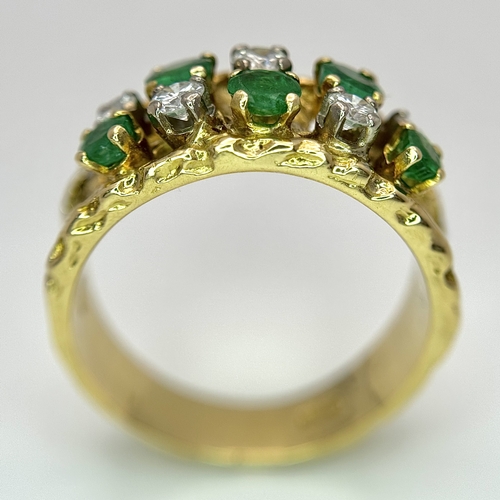 37 - An 18K Yellow Gold Emerald and Diamond Band Ring. c. 0.50ctw of round cut emeralds and c. 0.50ctw of... 
