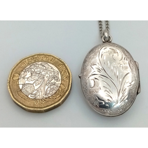 1181 - A vintage 925 silver stone set Oval locket pendant, set on a silver necklace. Total length 58cm, tot... 