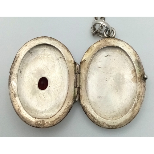 1181 - A vintage 925 silver stone set Oval locket pendant, set on a silver necklace. Total length 58cm, tot... 
