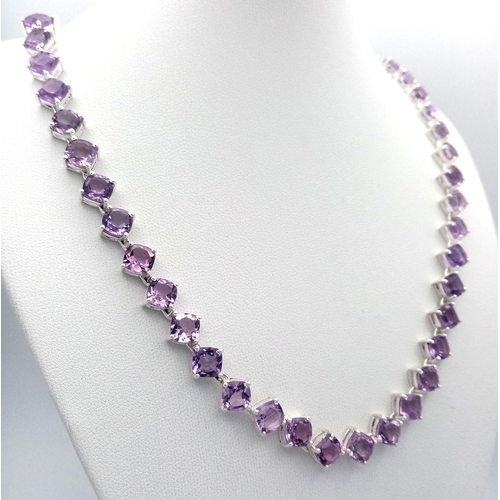 565 - An Amethyst Gemstone Tennis Necklace. Set in 925 Silver. 44cm length. CD-2059.