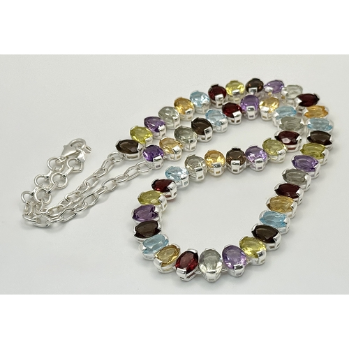 682 - An Amethyst, Citrine, Blue Topaz, Garnet and Peridot Gemstone Necklace. Set in 925 Silver. 44cm leng... 