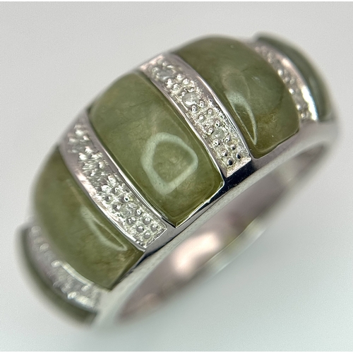 1273 - An Attractive Sterling Silver Jade and Diamond Ring Size P. The Ring is set with five graduating siz... 