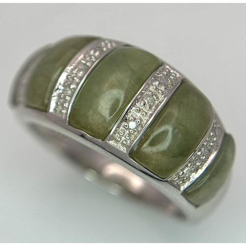 1273 - An Attractive Sterling Silver Jade and Diamond Ring Size P. The Ring is set with five graduating siz... 
