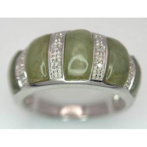 1273 - An Attractive Sterling Silver Jade and Diamond Ring Size P. The Ring is set with five graduating siz... 