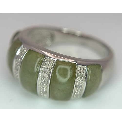 1273 - An Attractive Sterling Silver Jade and Diamond Ring Size P. The Ring is set with five graduating siz... 