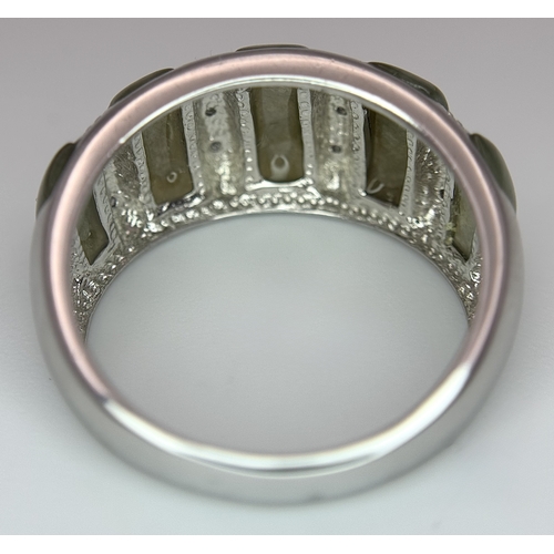 1273 - An Attractive Sterling Silver Jade and Diamond Ring Size P. The Ring is set with five graduating siz... 