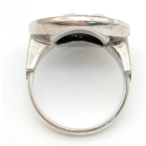 1619 - A Vintage Sterling Silver Wedgwood Black Cameo Ring Size M. The Ring measures 2cm Diameter at the Cr... 