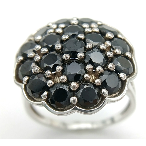 1697 - An Impressive Sterling Silver Black Spinel Cluster Ring Size R1/2. The Ring has a total of 6 Carats ... 