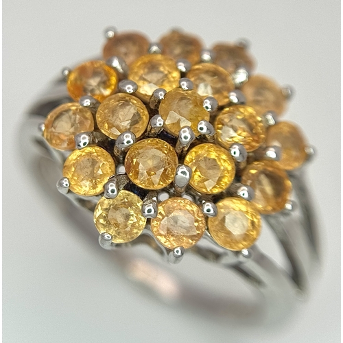 1764 - An Eye-Catching Sterling Silver Citrine Cluster Ring Size P1/2. The Ring measures 1.6cm Wide at the ... 
