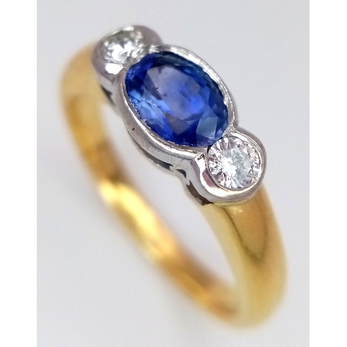 15 - An 18K YELLOW GOLD DIAMOND AND SAPPHIRE RING 0.30CT DIAMONDS AND 0.50CT OVAL SAPPHIRE 5.3G SIZE N 1/... 