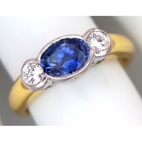 15 - An 18K YELLOW GOLD DIAMOND AND SAPPHIRE RING 0.30CT DIAMONDS AND 0.50CT OVAL SAPPHIRE 5.3G SIZE N 1/... 