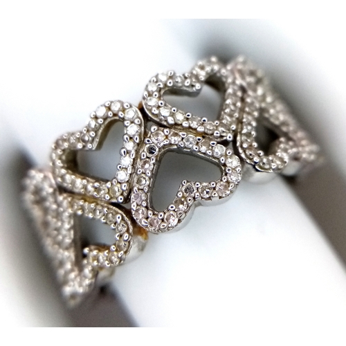 372 - A 9K WHITE GOLD TWO ROW DIAMOND SET HEARTS RING 4.8G SIZE P. Ref: TAN 7011
