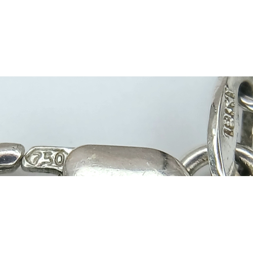 386 - An 18K WHITE GOLD DIAMOND SET PALM TREE PENDANT ON CHAIN 2.5G. Ref: TAN 7021