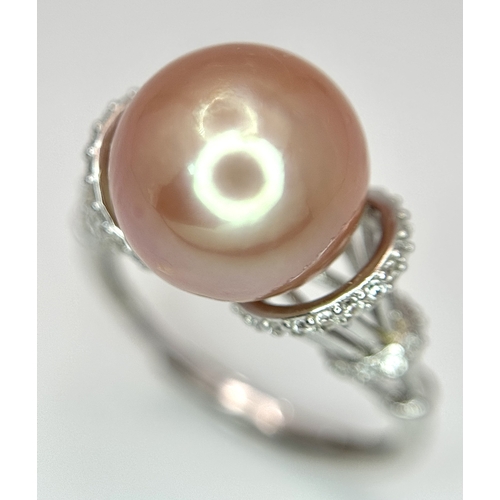 528 - A 925 Silver Cultured Pearl and CZ Ring. Featuring a beautiful rose gold cultured pearl accented by ... 