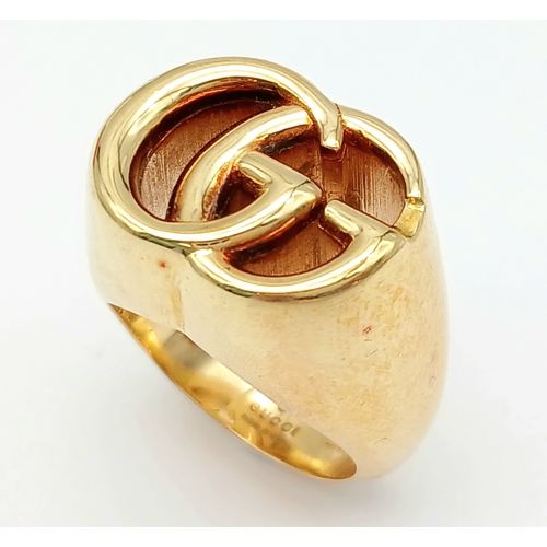 57 - An 18K YELLOW GOLD GUCCI GG RING 17.3G SIZE M. Ref: TAN 7023
