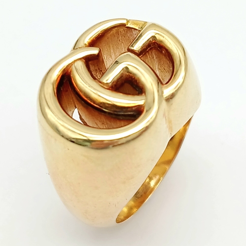57 - An 18K YELLOW GOLD GUCCI GG RING 17.3G SIZE M. Ref: TAN 7023