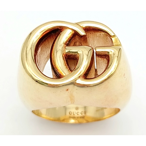 57 - An 18K YELLOW GOLD GUCCI GG RING 17.3G SIZE M. Ref: TAN 7023