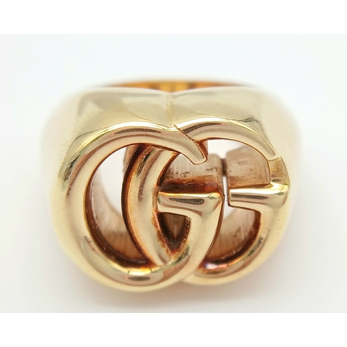 57 - An 18K YELLOW GOLD GUCCI GG RING 17.3G SIZE M. Ref: TAN 7023