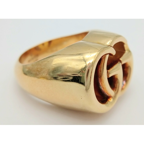57 - An 18K YELLOW GOLD GUCCI GG RING 17.3G SIZE M. Ref: TAN 7023