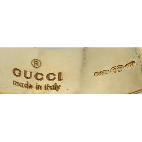 57 - An 18K YELLOW GOLD GUCCI GG RING 17.3G SIZE M. Ref: TAN 7023