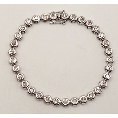 8 - An 18K WHITE GOLD DIAMOND SET TENNIS BRACELET, APPROX 2CT DIAMONDS 14.6G. Ref: SPSA 7001