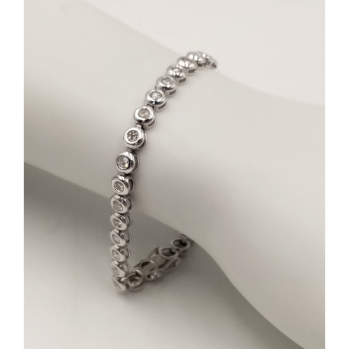 8 - An 18K WHITE GOLD DIAMOND SET TENNIS BRACELET, APPROX 2CT DIAMONDS 14.6G. Ref: SPSA 7001