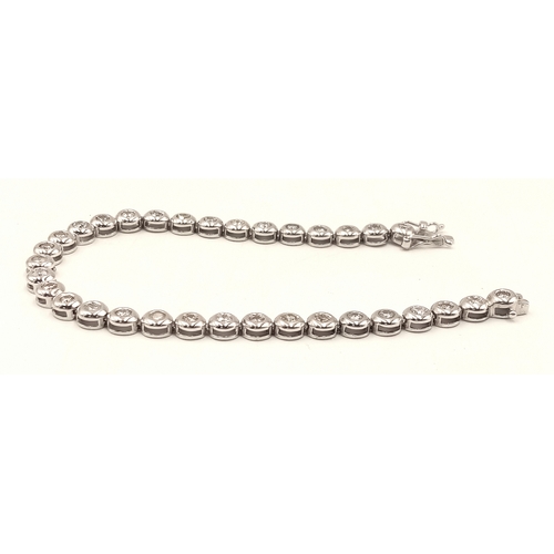 8 - An 18K WHITE GOLD DIAMOND SET TENNIS BRACELET, APPROX 2CT DIAMONDS 14.6G. Ref: SPSA 7001