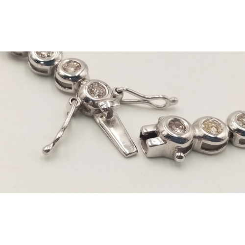 8 - An 18K WHITE GOLD DIAMOND SET TENNIS BRACELET, APPROX 2CT DIAMONDS 14.6G. Ref: SPSA 7001