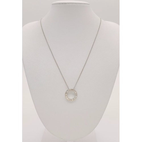 117 - An 18K WHITE GOLD DIAMOND SET ROUND PENDANT ON DISSAPEARING NECKLACE 4G. Ref: SC 7068