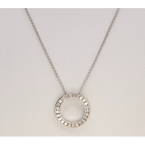 117 - An 18K WHITE GOLD DIAMOND SET ROUND PENDANT ON DISSAPEARING NECKLACE 4G. Ref: SC 7068