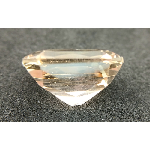 751 - A 24.40CT NATURAL PEACH/PINK TOPAZ EMERALD CUT . Ref: MGB 7002