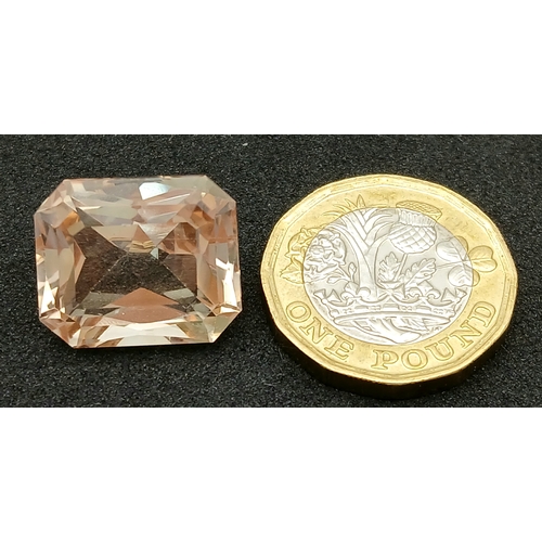 751 - A 24.40CT NATURAL PEACH/PINK TOPAZ EMERALD CUT . Ref: MGB 7002