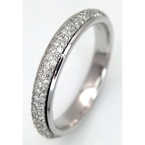 752 - An 18K White Gold Diamond Eternity Ring. Three row pave set diamonds. Size M. 3.13g total weight. MT... 
