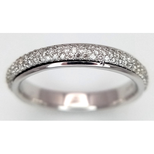 752 - An 18K White Gold Diamond Eternity Ring. Three row pave set diamonds. Size M. 3.13g total weight. MT... 