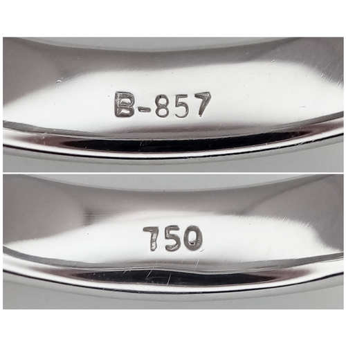 752 - An 18K White Gold Diamond Eternity Ring. Three row pave set diamonds. Size M. 3.13g total weight. MT... 