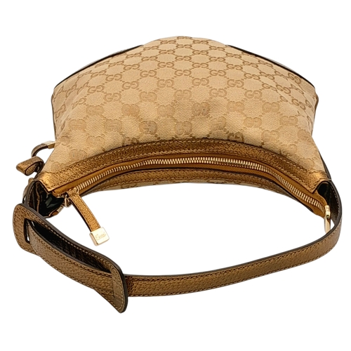 601 - A Gucci Monogram Princy Hobo Bag. Canvas exterior with metallic leather trim, single strap, silver-t... 