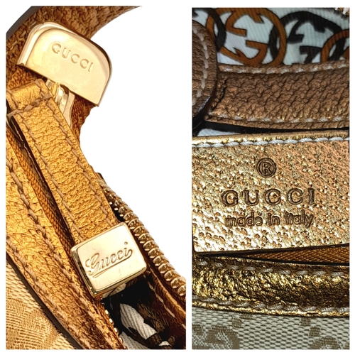 601 - A Gucci Monogram Princy Hobo Bag. Canvas exterior with metallic leather trim, single strap, silver-t... 