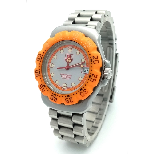 118 - A Tag Heuer Orange Bezel Quartz Gents Watch. Model 373-513. Stainless steel bracelet and case - 32mm... 