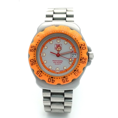 118 - A Tag Heuer Orange Bezel Quartz Gents Watch. Model 373-513. Stainless steel bracelet and case - 32mm... 