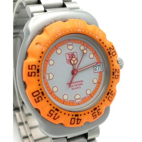118 - A Tag Heuer Orange Bezel Quartz Gents Watch. Model 373-513. Stainless steel bracelet and case - 32mm... 