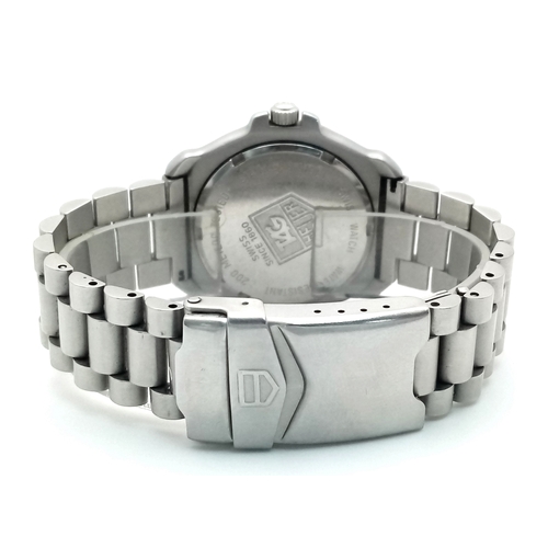 118 - A Tag Heuer Orange Bezel Quartz Gents Watch. Model 373-513. Stainless steel bracelet and case - 32mm... 