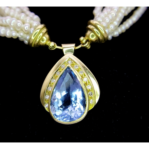 26 - A MULTISTRAND FRESHWATER PEARL NECKLACE WITH 18K YELLOW PENDANT CLASP SET WITH DIAMONDS AND BLUE TOP... 