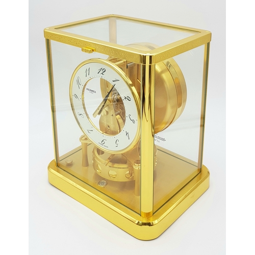 27 - A Beautiful Jaeger-LeCoultre Hermes Gilded Mantle Clock. Atmospheric clock with white openwork dial ... 