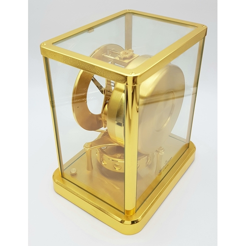 27 - A Beautiful Jaeger-LeCoultre Hermes Gilded Mantle Clock. Atmospheric clock with white openwork dial ... 