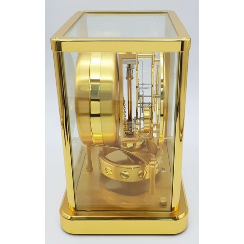 27 - A Beautiful Jaeger-LeCoultre Hermes Gilded Mantle Clock. Atmospheric clock with white openwork dial ... 