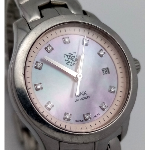 34 - A Tag Heuer Link Mother of Pearl Ladies Quartz Watch. Model - WJFT31B. Stainless steel bracelet and ... 