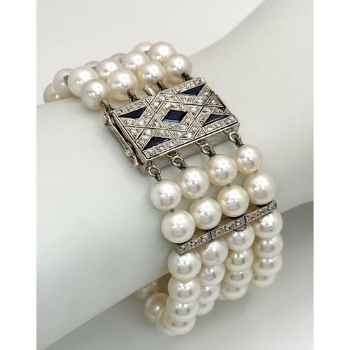 47 - A FOUR ROW AKOYA PEARL BRACELET WITH A 14K WHITE GOLD DIAMOND AND SAPPHIRE SET CLASP. A BEAUTIFUL PI... 