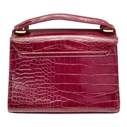 503 - A Harrods Purple Croc-Effect Shoulder Bag. Purple textile exterior with gold-toned hardware, single ... 